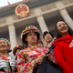 Delegates in ethnic minority dress pose for photos on Mar. 4 ahead of this year’s NPC meeting.